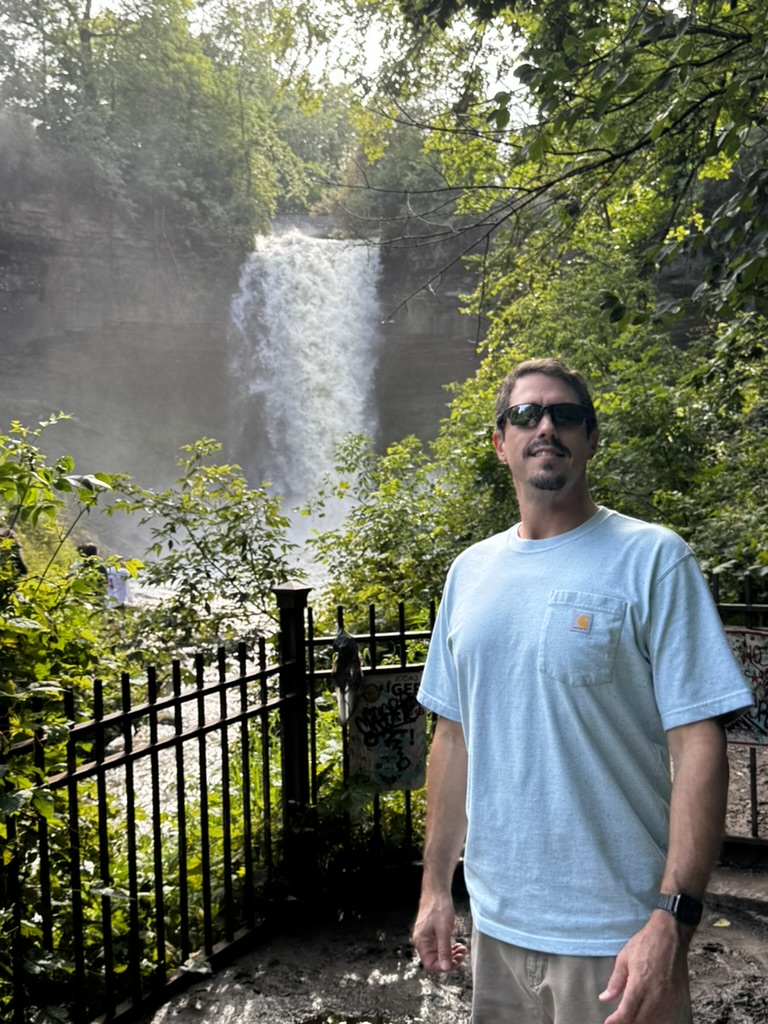 Mike visiting a waterfall